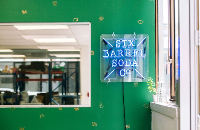 Six Barrel Soda Co. signage.