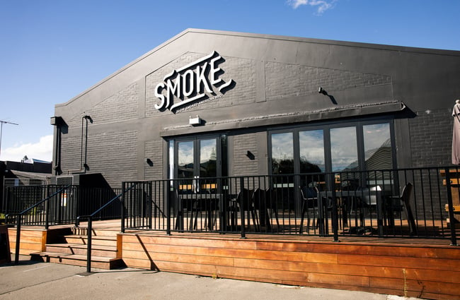 The black painted exterior of Smoke restaurant in Ashburton.