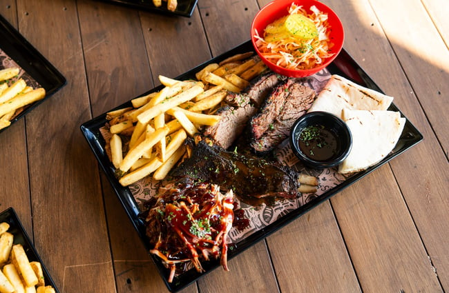 Ribs and fries on a plate.