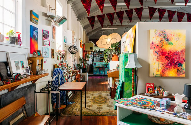 The entrance to a busily decorated artist studio and gallery.