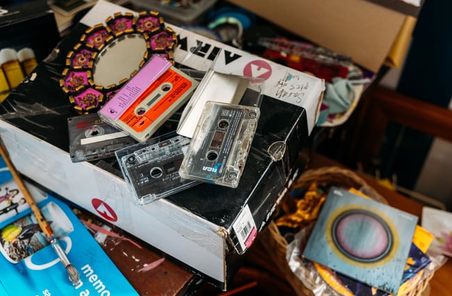A close up of cassette tapes in a box.