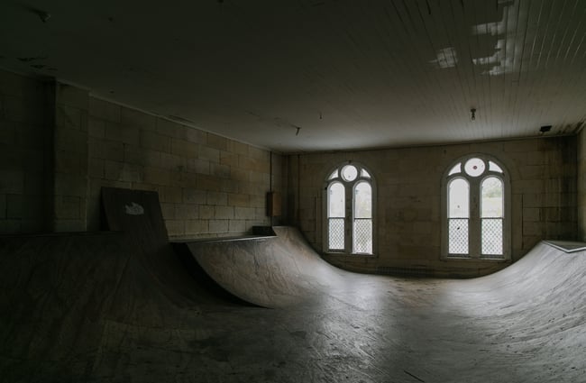 A darkly lit view of the half pipe upstairs at Soul Surf and Skate Oamaru.
