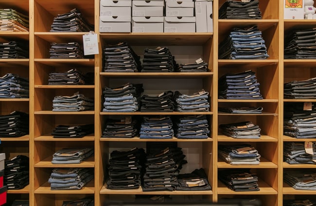 Cubby holes of neatly folded jeans.