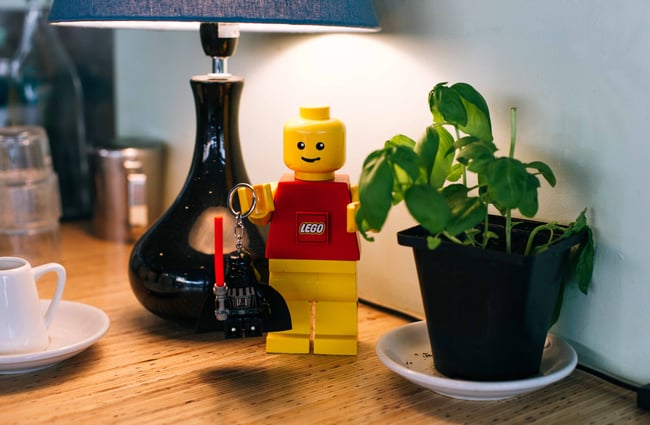 Yellow LEGO man under a lamp.