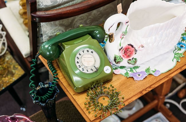 Close up of green old-fashioned telephone at retro store
