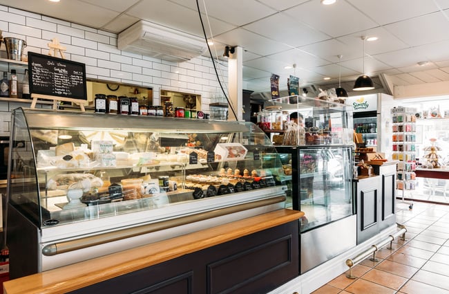 Cabinet of deli items and handmade pastries and tarts at Tartines in Wellington