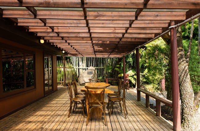 An outdoor dining area in native bush.