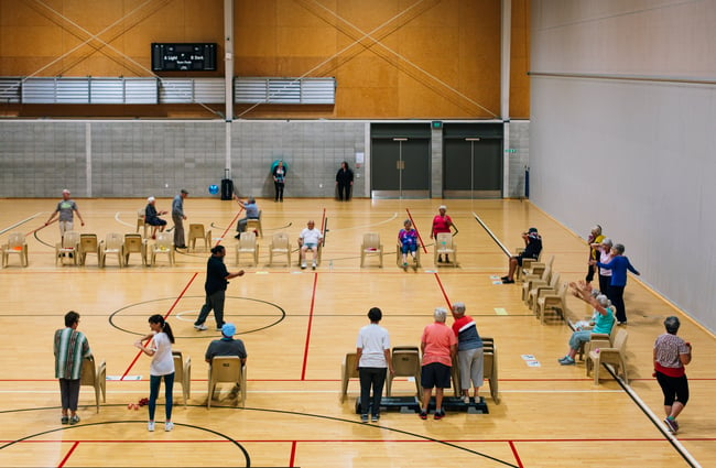 Courts with people playing a game.