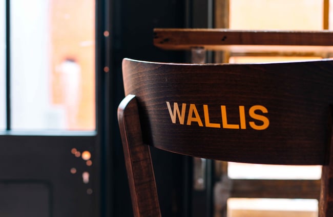 Wooden chair with Wallis written on it in gold.