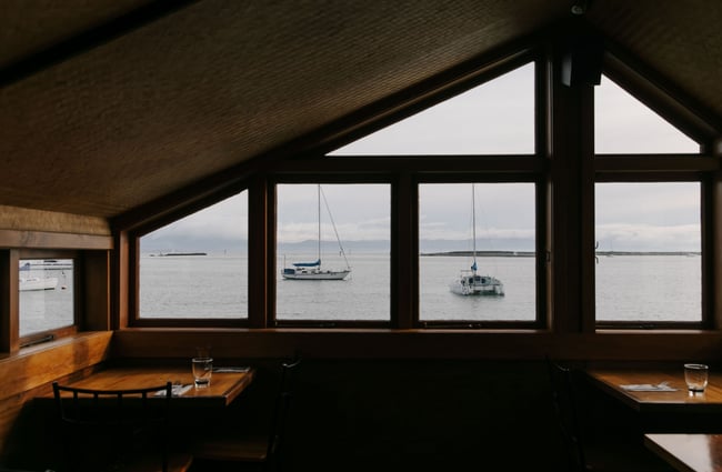 View out to sailing boats at Boat Shed Cafe.