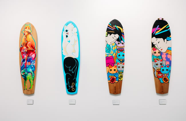 A close up of art painted on to skateboards.