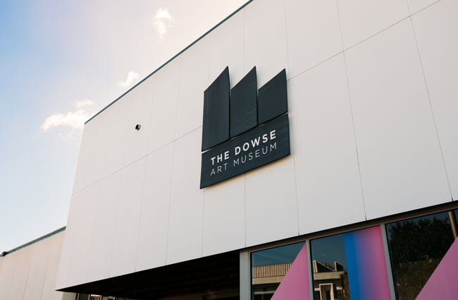 A Dowse museum sign on a building.