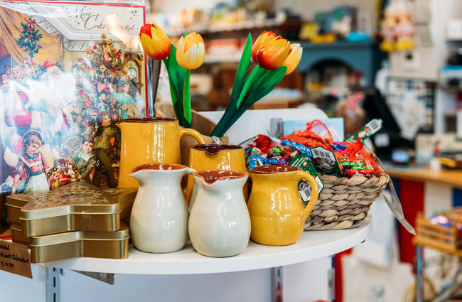 Dutch tulips and ceramics on shelf in store