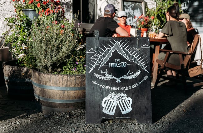 A blackboard outside The Fork and Tap Arrowtown.