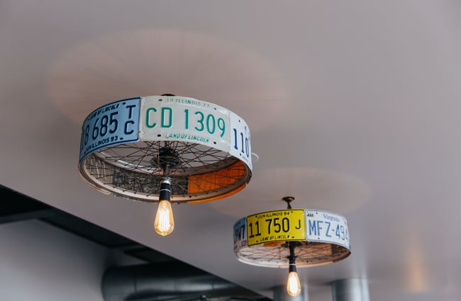 Close up of lightshades made of number plates.