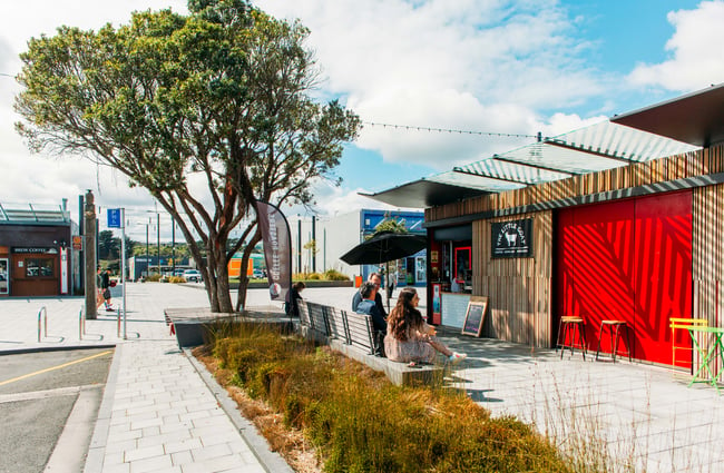 People sat on the benches outside The Little Goat in Porirua.