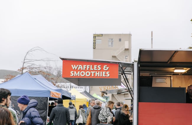 People outside the waffle stall at The Nelson Market, Nelson.