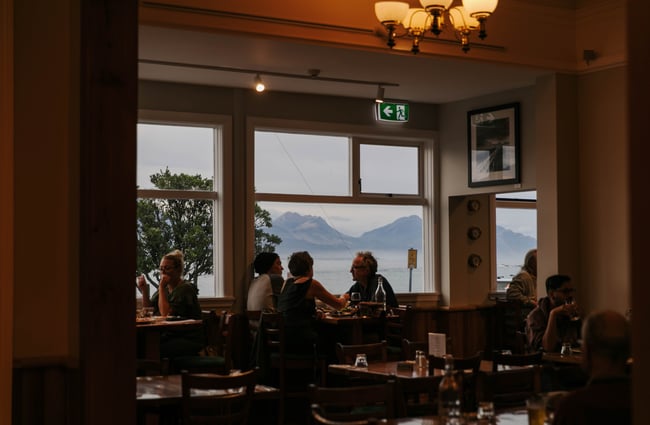 View of the dining room out to the mountains in the background.
