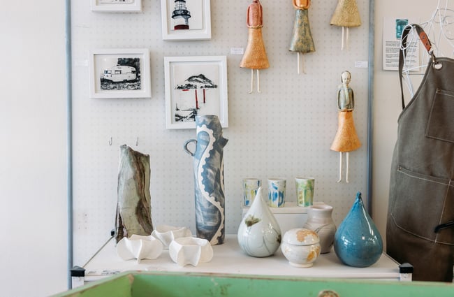 Ceramics on display on a white table.