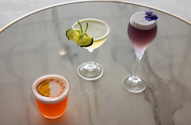 Three cocktails on a table.