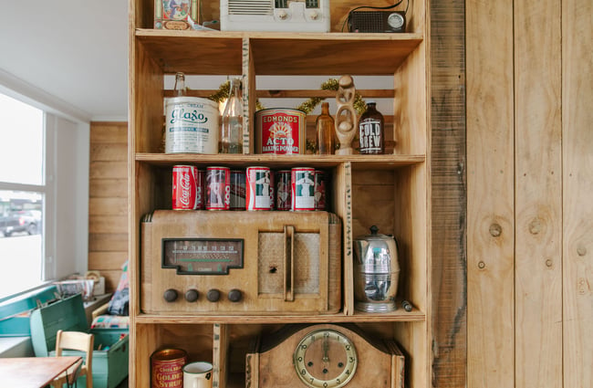 A close up of a retro speaker system and old coke cans at The Running Duck cafe in Geraldine.