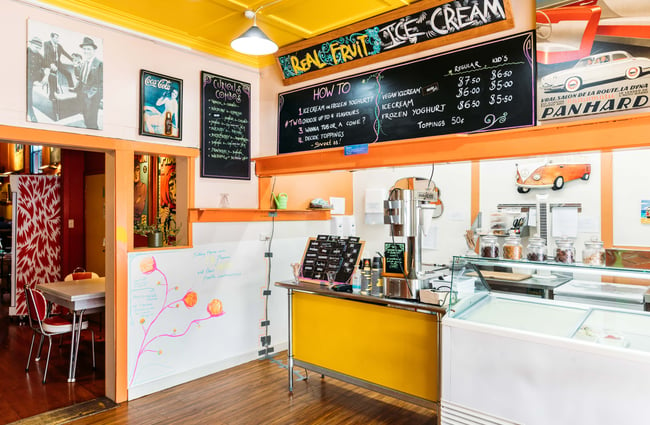 The real fruit ice cream counter inside a brightly coloured Wholemeal Cafe.