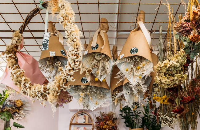 Dried flowers hanging upside down from the ceiling.