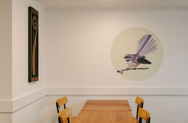 Fantail print above table at The Yellow Door, Timaru.