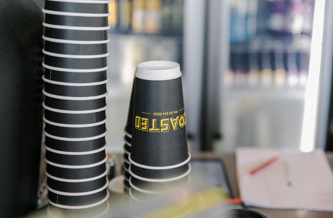 Close up of takeaway coffee cups.