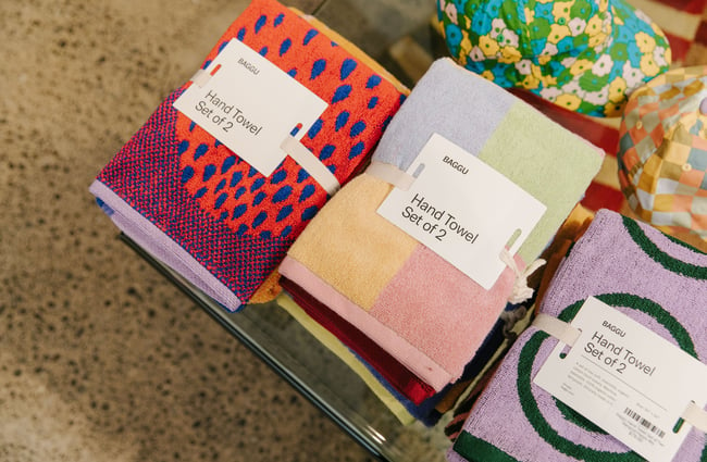 A close up of brightly coloured towels on a table.