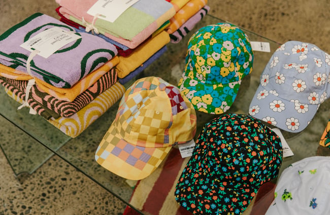 A close up of colourful hats and towels.