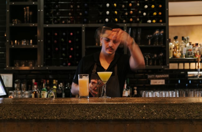 Man making cocktail at the bar.