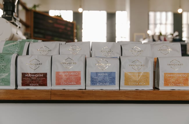 Bags of Vanguard coffee on front counter.