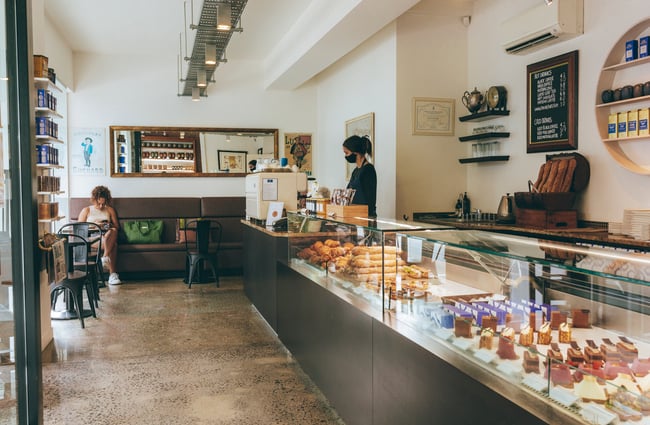 View of the counter area with seating area at Vaniyé Pâtisserie, Auckland.