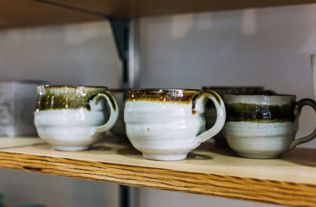 Cups on a shelf.