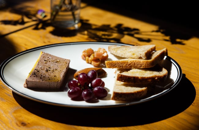 Pate and bread on a plate.