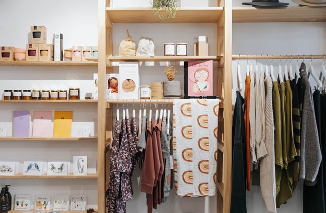 Clothes and homewares on shelves.