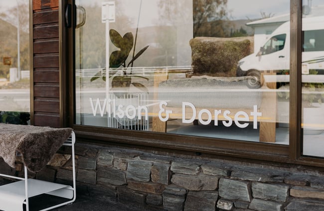 Wilson & Dorset lettering in the window of the shop in Wānaka.