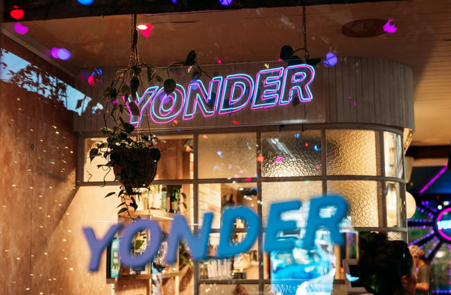 A fluorescent 'Yonder' sign.