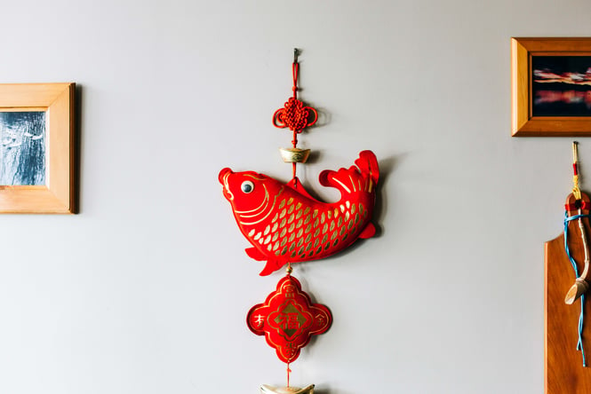 A red fish ornament on a wall inside the Dumpling House in Hamilton.