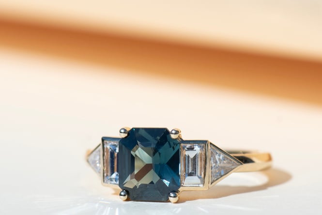 A green sapphire diamond ring by Zoe and Morgan.