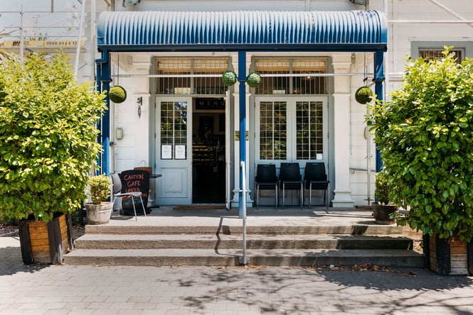 The blue and white entrance to Cafe Esplanade in Palmerston North.
