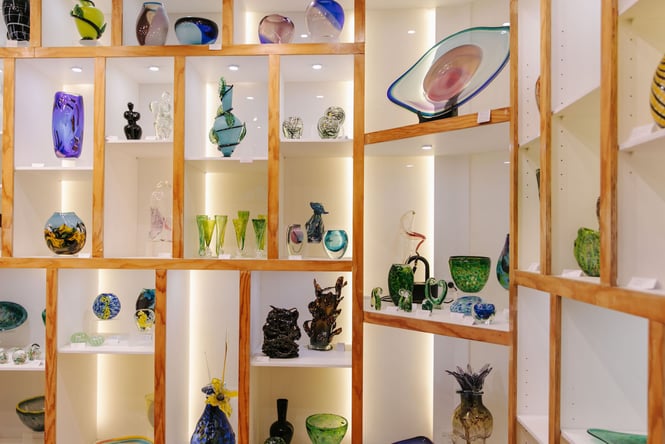 Colourful glass vases on display.