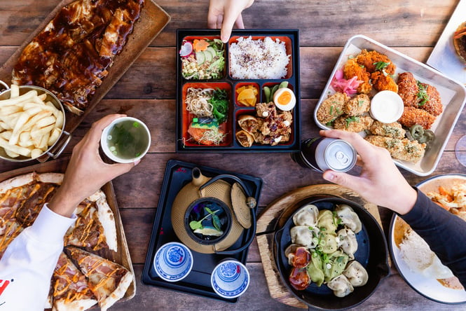 A selection of sushi, dumplings, pizza, ribs and more on the table at Little High Eatery in Christchurch