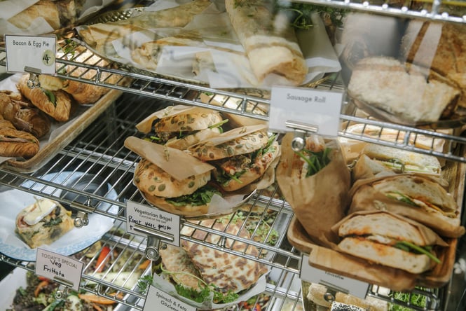Bagels, sandwiches, sausage rolls and salads in the cabinet of Foundation Cafe in Christchurch