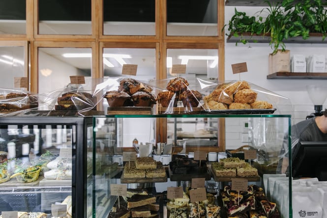 Sweet slices and muffins in the cabinet at Unknown Chapter in Christchurch