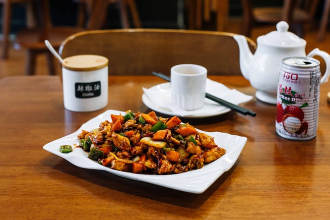 A close up of a plate of Chinese food on a table at New Flavour in Auckland.