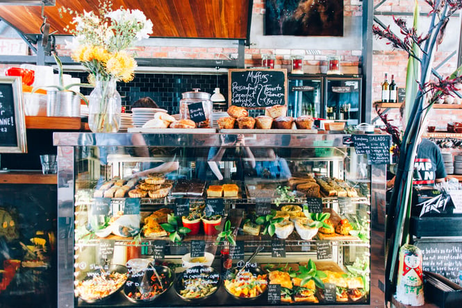 Cabinet of sweet baked treats and lunch options at Lyttelton Coffee C