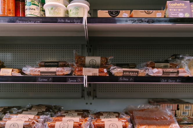 Vegan meats on display in a fridge.