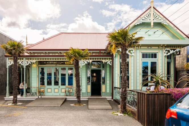 The green exterior of House of Good Fortune in Petone.